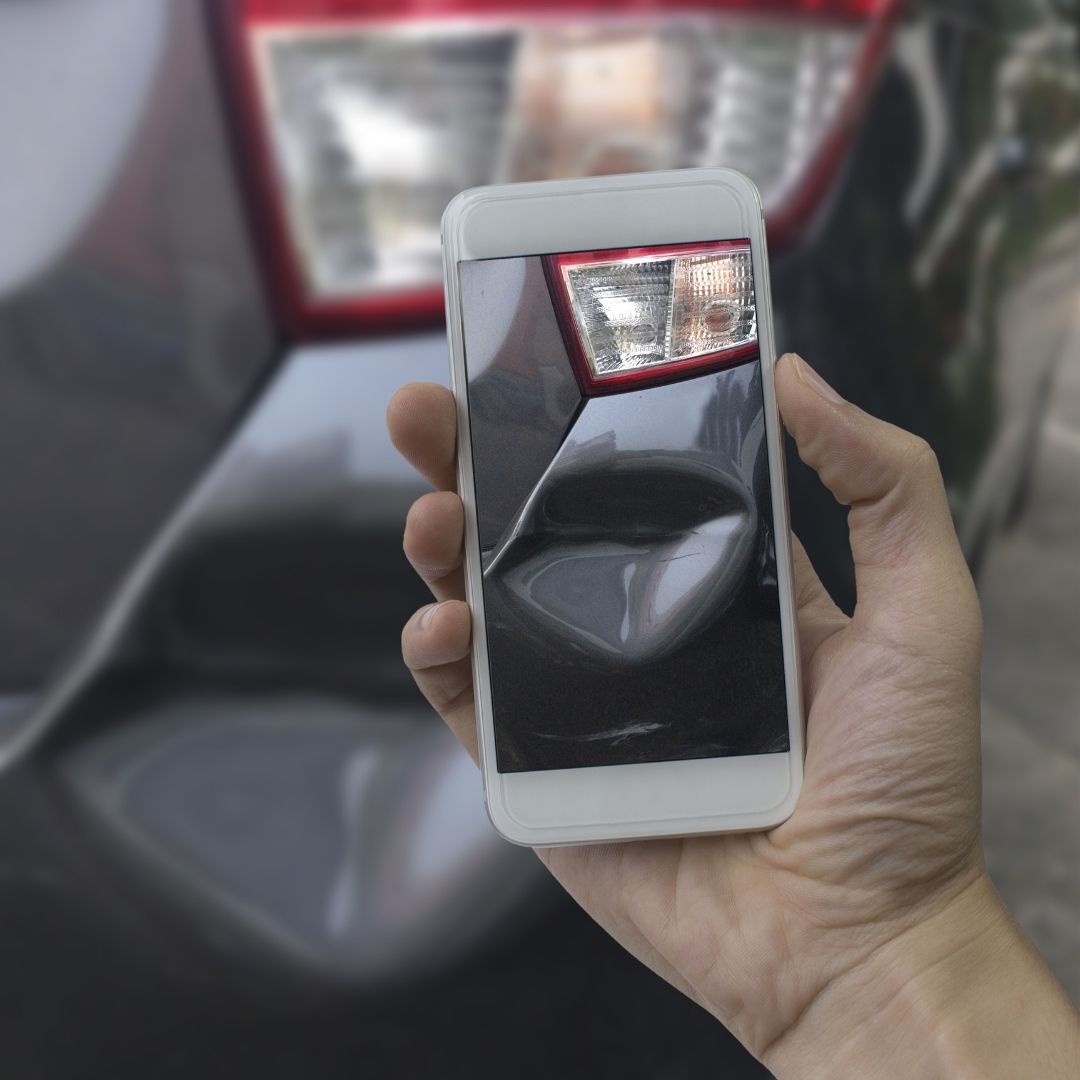 photographing damage on car
