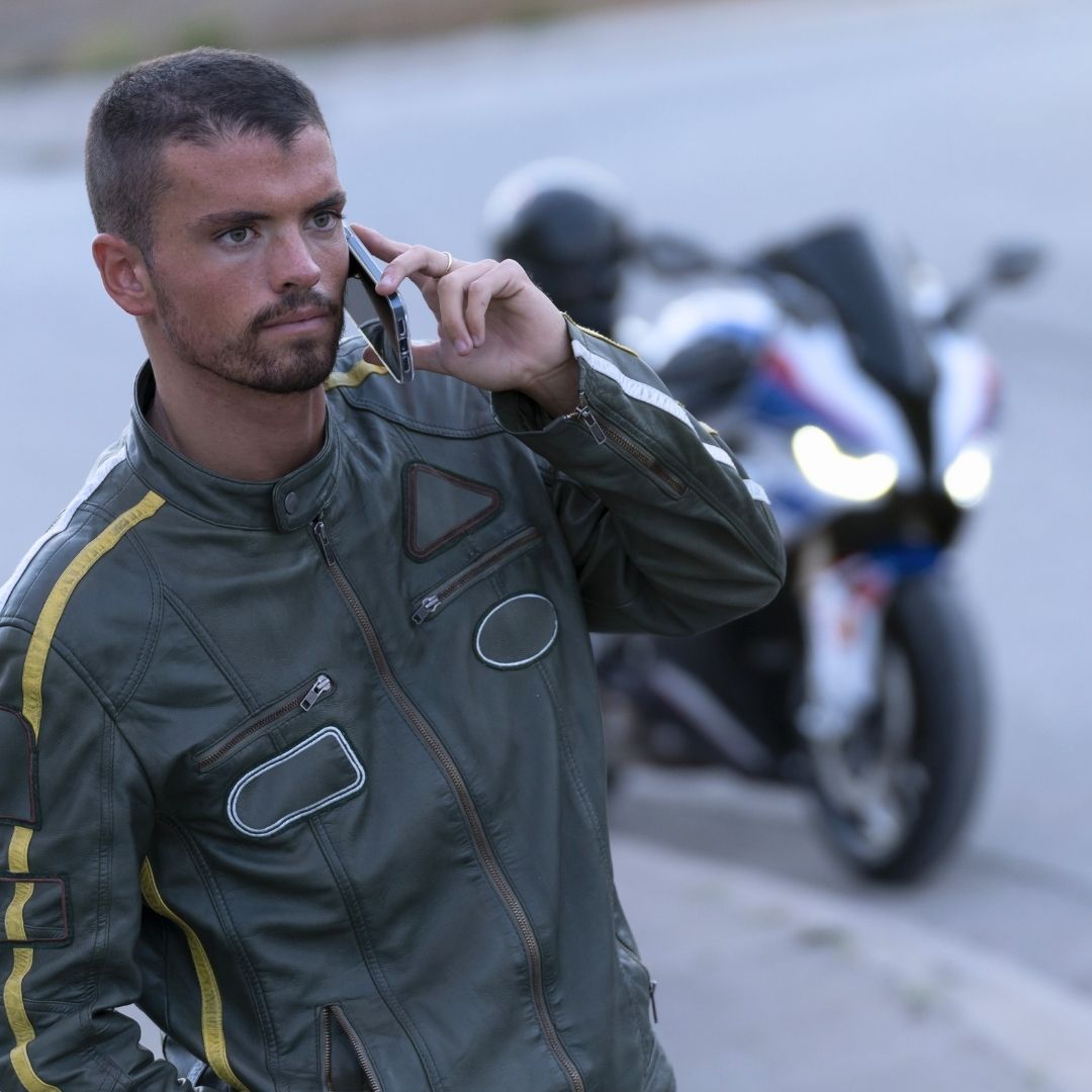 motorcyclist using phone